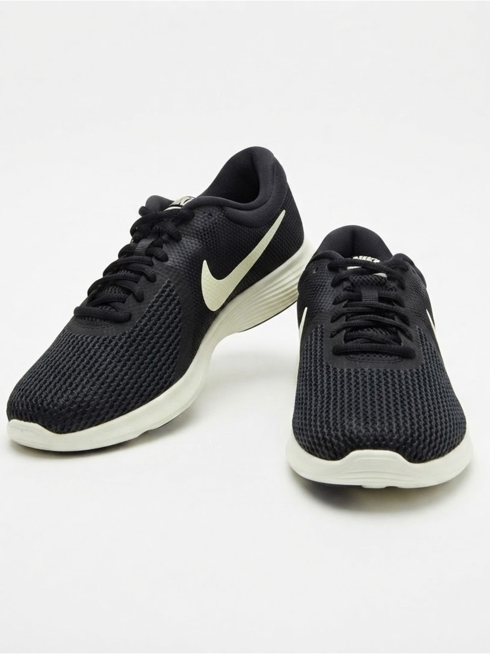 Nike Men’s Black Athletic Running Shoes with White Swoosh